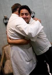 Ricardo greets ophthalmologist Dr. Tornambe with a hug after his successful surgery to restore his eyesight.