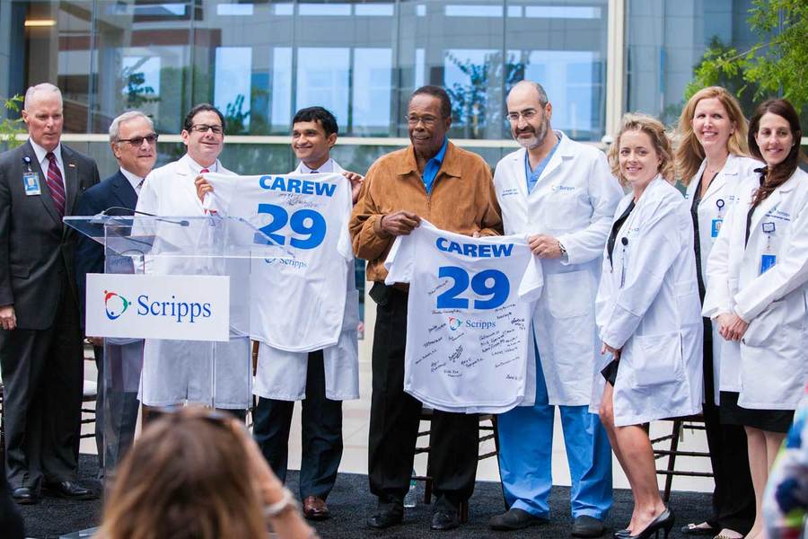 MLB hall of famer, Rod Carew, stands with his doctors as his story and the Scripps LVAD program was featured in a magazine.