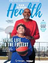 The cover of San Diego Health shows a man and a child on a basketball court.