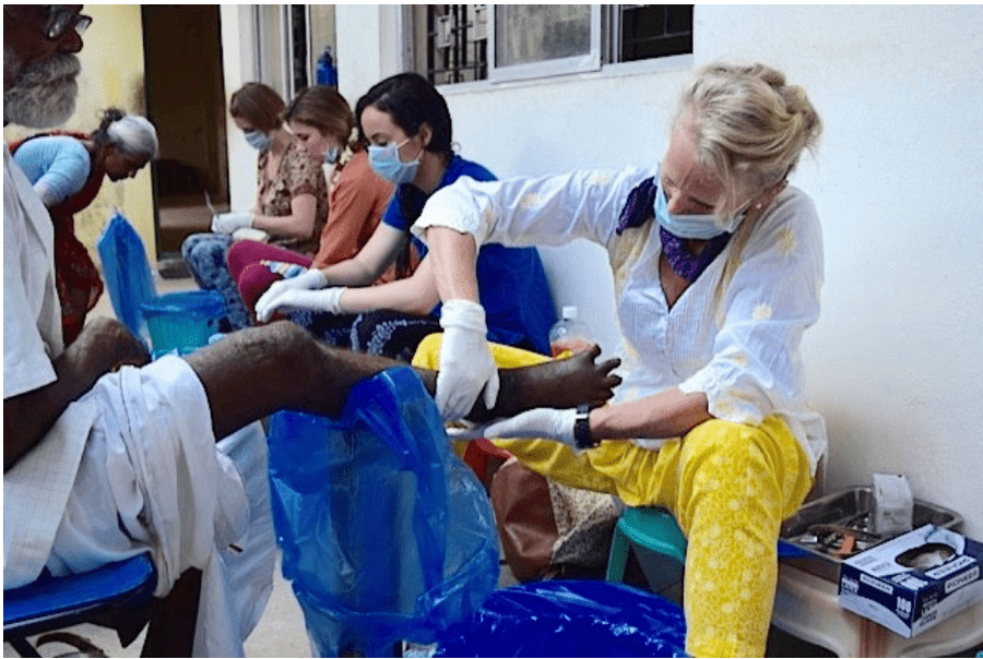 Scripps Encinitas philanthropist, Sandy Marriott Bertha, treats a patient in an under-served community abroad. 