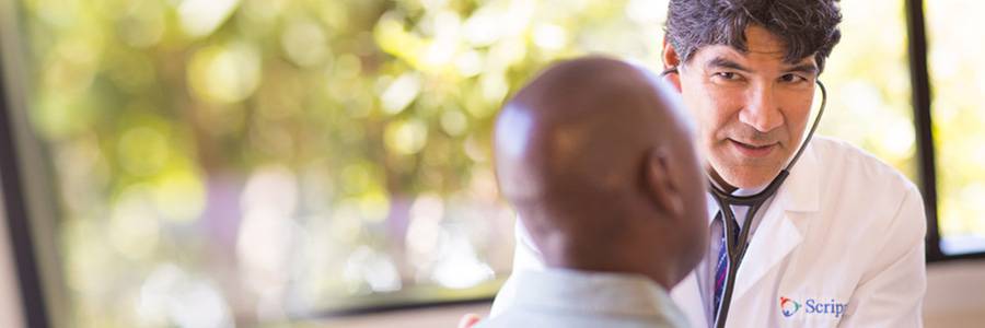 Family medicine doctor Gerard Lumkong, MD, listens to his patient’s heart.