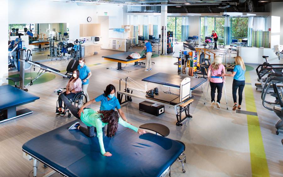 Interior photo of the Scripps Encinitas Rehabilitation Services building, depicting different sets of equipment that are available at this facility for Physical and Occupation therapy.