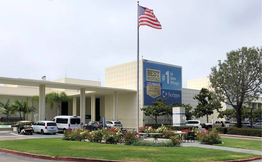 A flagpole and exterior of Scripps Green Hospital in La Jolla, San Diego.