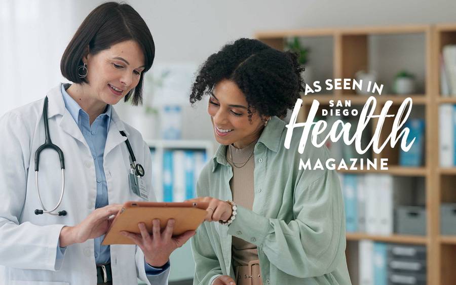 A female doctor reviews a treatment plan with a female patient. 