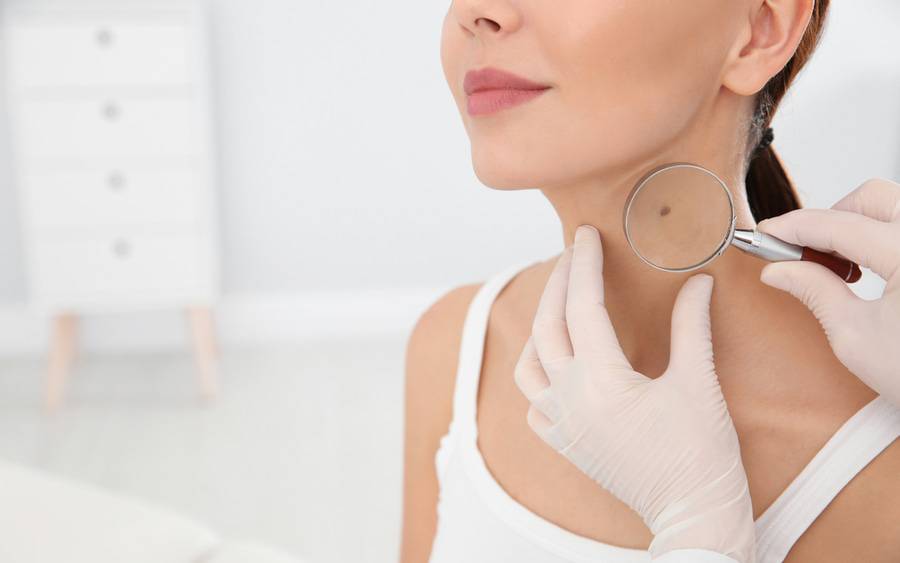 A woman gets a skin cancer exam.