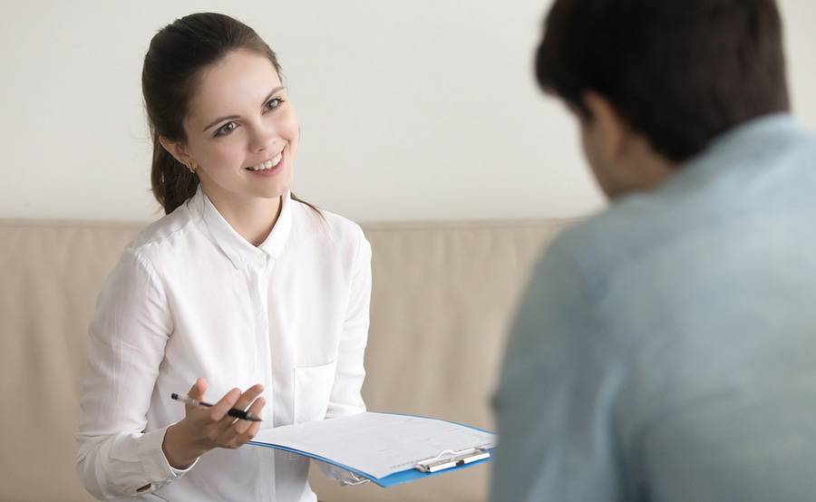 A young professional counsels a patient, representing speech therapy at Scripps.