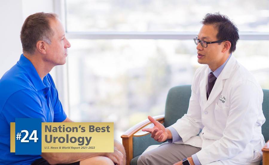 A urologist talks with a male patient about advanced techniques to diagnose urinary tract conditions.