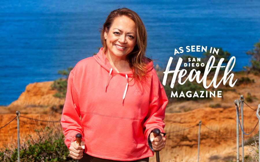 Vivian Cortes-Addeo hikes by the ocean after life-saving spine surgery.  SD Health Magazine
