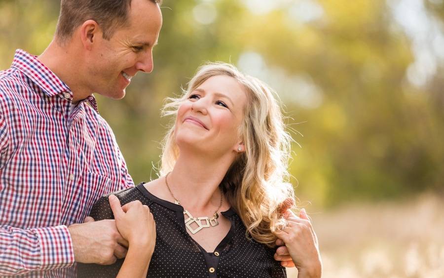 Woman with bladder condition holds her spouse's hands for comfort.