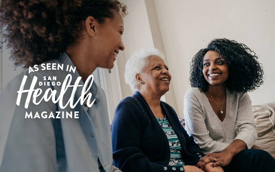 A smiling elderly woman sitting with two younger women illustrates how taking steps to prevent heart disease can lead to a long, healthy and active life.