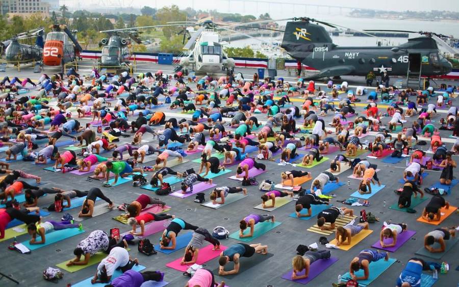 Yoga enthusiasts at Yoga on Midway presented by Scripps Health