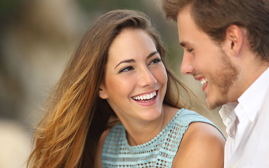 Young couple smiling at each other and happy.