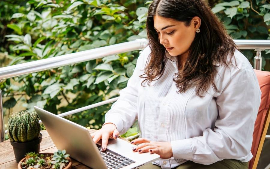 A young, heavyset woman researches gastric sleeve surgery.