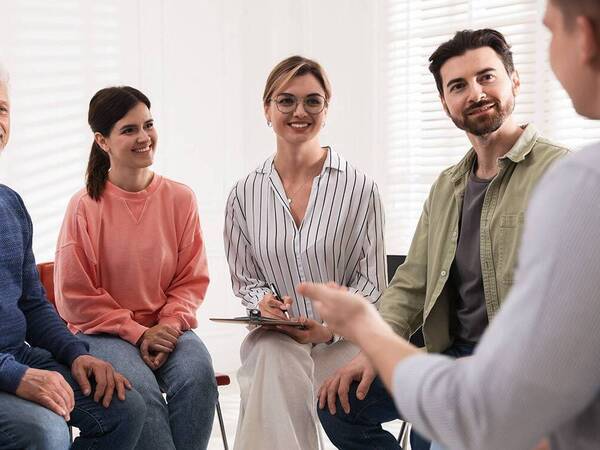 A group of men and women share experiences to help with challenges of helping loved that have serious health issues.