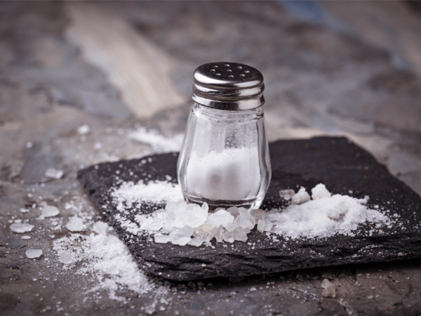 A salt shaker is shown to illustrate an article on the health dangers of consuming too much sodium.
