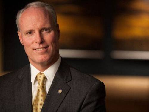 Scripps Health CEO Chris Van Gorder posing for a photo