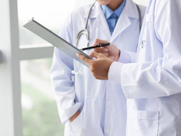 Doctor, physician, lab coat, leadership.