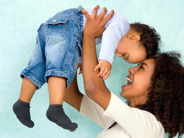 Young african american woman with child.