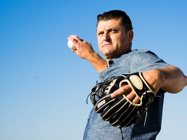 Padres Hall of Fame pitcher Trevor Hoffman practices pitching a baseball after shoulder replacement surgery at Scripps.