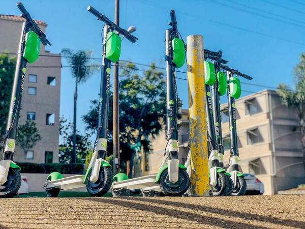 Motorized scooters left unattended on the street are used to help illustrate the dangers of these vehicles for pedestrians and others.