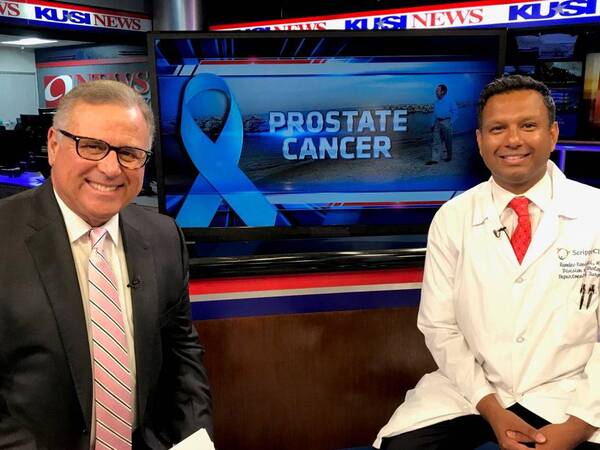 KUSI anchor Carlos Amezcua and Ramdev Konijeti, MD, a urologist, at KUSI, discussing prostate cancer.