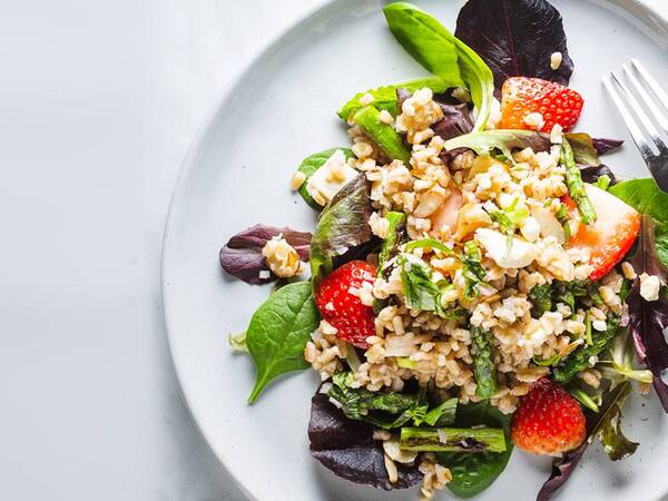 A nutritious salad made with barley, fresh strawberries and grilled asparagus is hearty enough to enjoy for lunch or dinner.