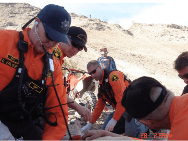 Scripps Health President and CEO Chris Van Gorder recently went into EMT mode to help an ailing passenger on a flight. Seen in this photo helping with a rescue mission in a separate incident.