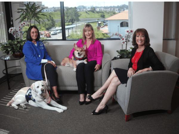 Rosemary Van Gorder and her dog Amber; Jill Sandman and JoJo, and San Diego Health Host Susan Taylor discussing the benefits of pet therapy.