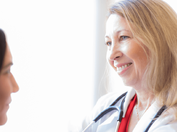 A Scripps Health Express providers examines a patient at Liberty Station site.