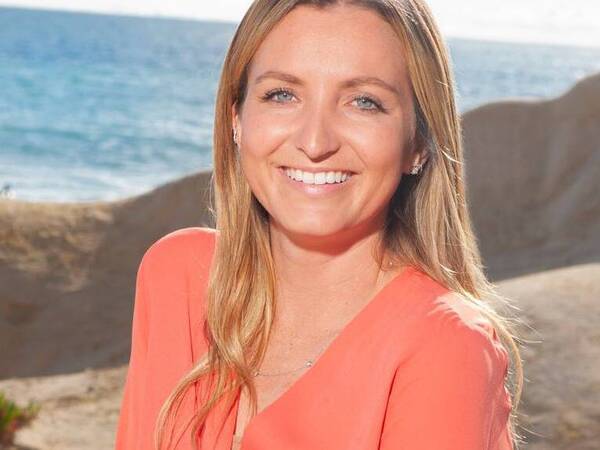 Ariana Collopy smiles at the beach after Scripps doctors helped find the right medication to control her seizures. 