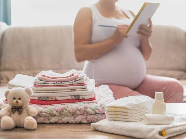 An expectant mother planning a nesting party before her baby arrives.