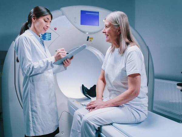 A patient gets ready for a CT scan.