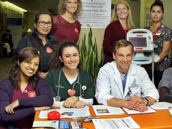 Scripps employees pose for a photo at the Love Your Heart Blood Pressure Screening.  The organization joined the joined the County of San Diego for the sixth annual event. It's one of the many community health services at Scripps.