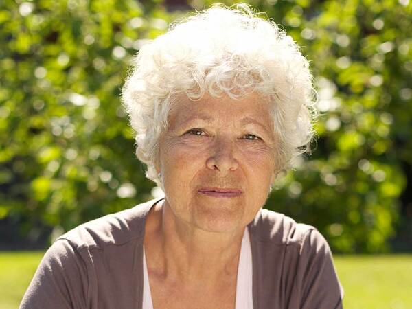 A serious mature woman represents the importance of learning more about a lung cancer diagnosis.