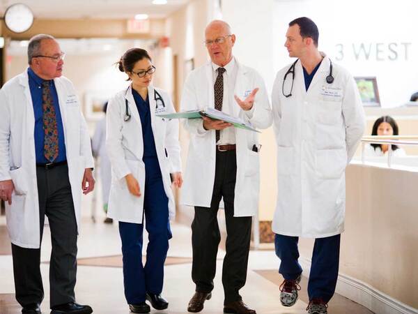 A group of Scripps LVAD physicians discuss patient care after receiving a referral.
