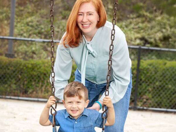 Olivia Smoak, a Scripps patient, and her son are playing on a playground in San Diego, illustrating how Scripps delivers life-saving care.