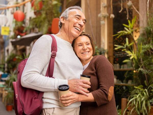 A happy mature couple on vacation represents the successful treatment of disorders of the colon.