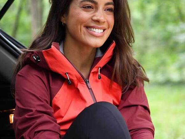 A young female spending time outdoors smiling illustrating the lifestyle after endometriosis treatment at Scripps.