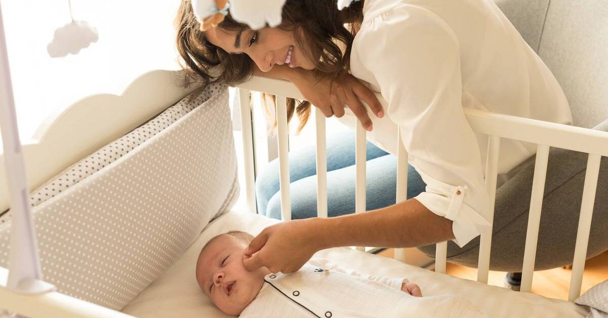 Putting newborn shop in crib
